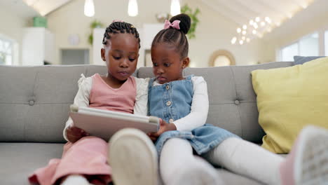 Black-girl-children,-tablet-on-sofa