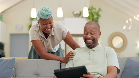 Black-couple,-laughing-and-tablet-on-a-home-sofa