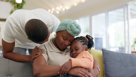 Black-family,-relax-and-parents-hug-child-on-sofa