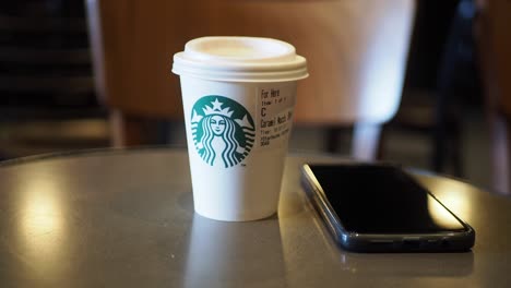 Starbucks-coffee-cup-on-cafe-table