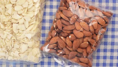 Top-view-of-almond-nut-and-slice-in-a-packet-on-table-,