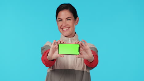 Woman,-phone-and-show-green-screen-in-studio