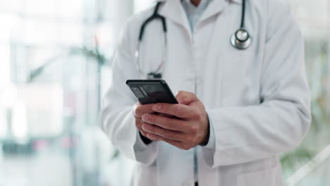 Phone,-research-and-hands-of-doctor-in-hospital