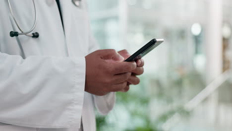 Phone,-research-and-hands-of-doctor-in-hospital