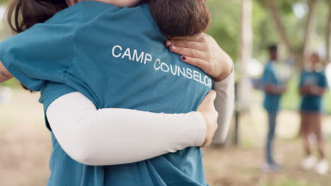 Camping,-summer-and-a-counselor-hugging-a-woman