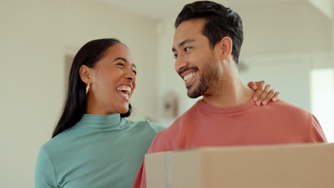 Happy,-moving-and-couple-with-a-box-for-their-new