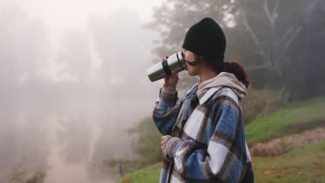 Drinking-coffee,-hike-and-woman-outdoor-with-peace