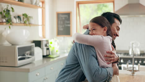 Family,-father-and-daughter-hug-in-the-kitchen