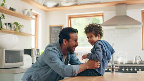 High-five,-dad-and-kid-playing-in-the-kitchen