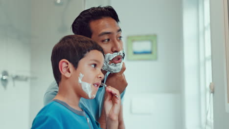 Dad,-boy-and-learning-to-shave-in-bathroom