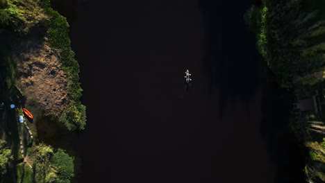 Aerial-drone-view,-lake-and-kayak-for-fitness