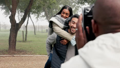Couple,-piggyback-and-photographer-at-park-to-take