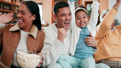 Family,-popcorn-and-celebrate-on-a-sofa-at-home-to