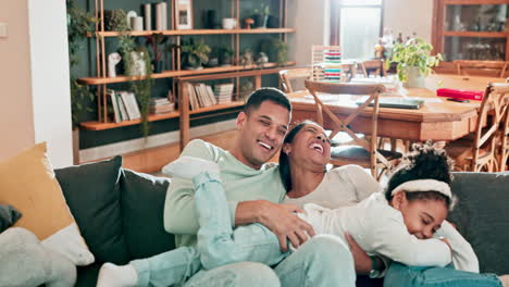 Family,-hug-and-laughing-on-a-sofa-at-home-to
