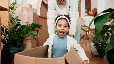 Girl,-playing-and-father-with-box-at-real-estate