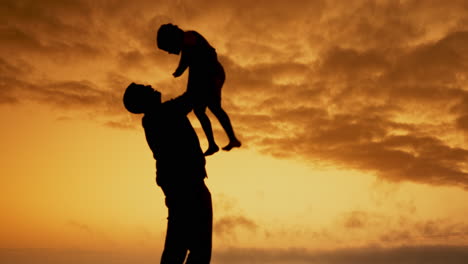 Father,-lifting-and-kid-with-freedom