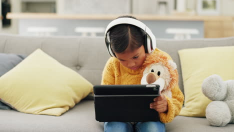 Tablet,-headphones-and-girl-or-child-learning