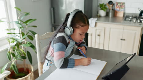 Online-class,-tablet-and-child-with-headphones