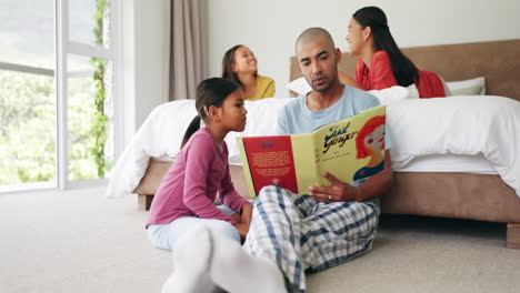 Father,-kids-and-reading-books-in-bedroom