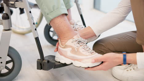 Caregiver,-shoes-and-senior-woman-in-wheelchair