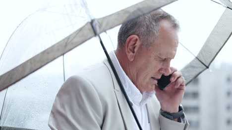 Phone-call,-senior-and-business-man-with-umbrella