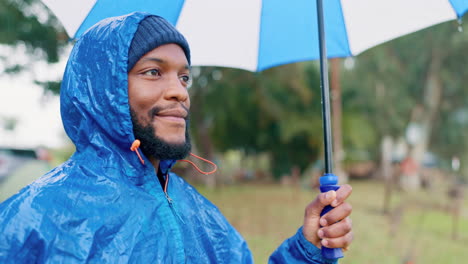 Rain,-umbrella-and-happy-with-black-man-in-nature