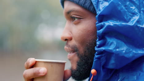Camping,-winter-and-a-black-man-drinking-coffee