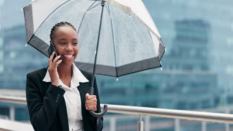 Talking,-umbrella-and-a-black-woman-on-a-phone