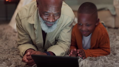 Kid,-learning-and-grandfather-with-tablet-in-home