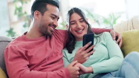 Holding-hands,-hug-and-couple-on-sofa-with-phone