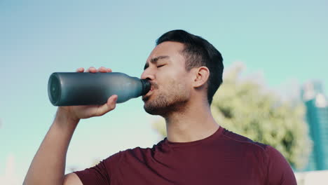 Fitness-health,-outdoor-and-man-drinking-water