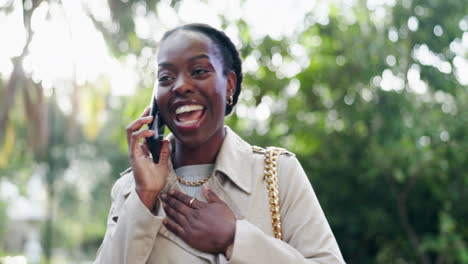 Winning,-phone-call-and-black-woman-in-park