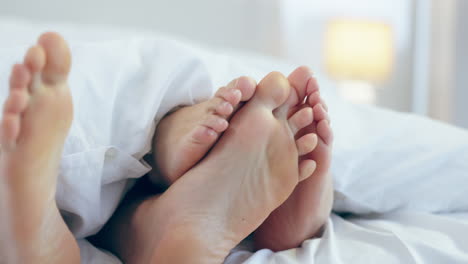 Closeup,-playful-and-feet-of-a-couple-in-a-bed