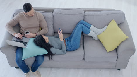 Top-view,-relax-and-couple-on-sofa-with-technology