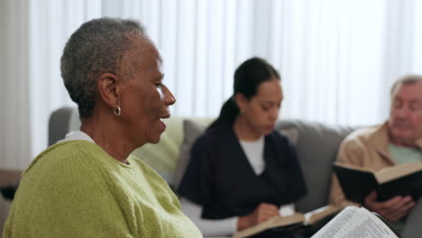 Senior-black-woman,-bible-and-group-in-home