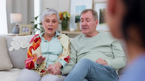 Senior-couple-on-sofa,-marriage-counselling