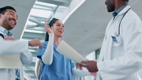 Doctors,-high-five-and-teamwork-for-healthcare