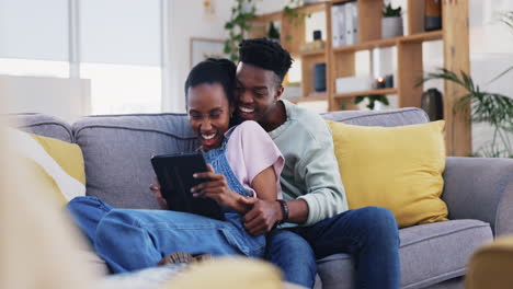 Tablet,-black-couple-and-funny-on-home-sofa