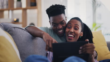 Tablet,-funny-and-black-couple-talking-in-home