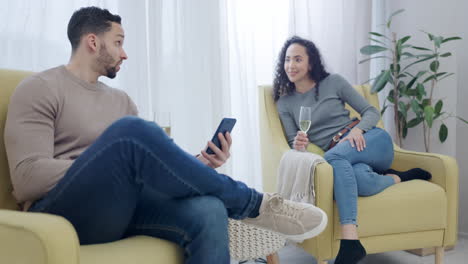 Man,-woman-and-champagne-in-lounge-with-phone