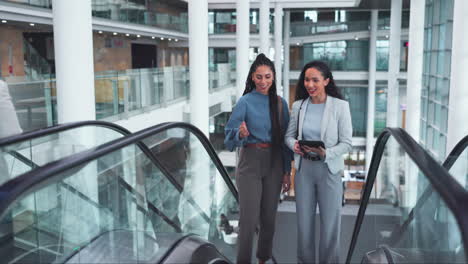 Escalator,-office-and-business-women-on-tablet
