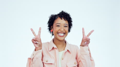 Woman,-peace-sign-and-smile-on-face-in-studio