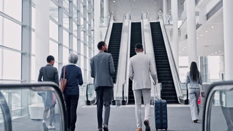 Business-people,-suitcase-and-airport-escalator