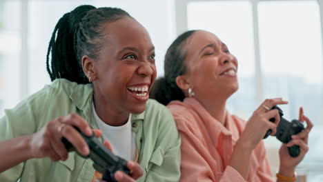 Friends,-video-game-and-excited-women-on-sofa