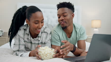 Popcorn,-relax-and-couple-on-laptop-for-movie
