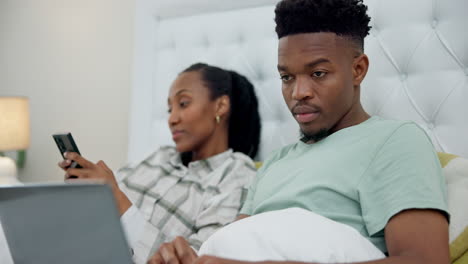Laptop,-phone-and-black-couple-relax-in-bed