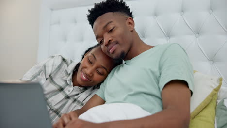 Love,-happy-and-black-couple-in-bed-with-a-laptop