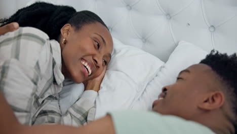 Happy,-care-and-a-black-couple-on-a-bed