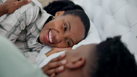 Laughing,-care-and-a-black-couple-on-a-bed