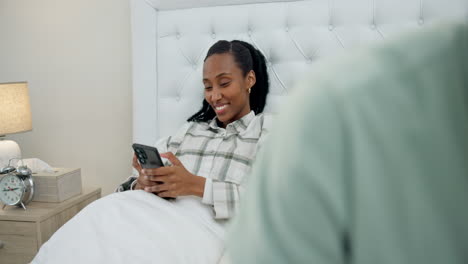 Phone,-smile-and-black-woman-typing-in-bed
